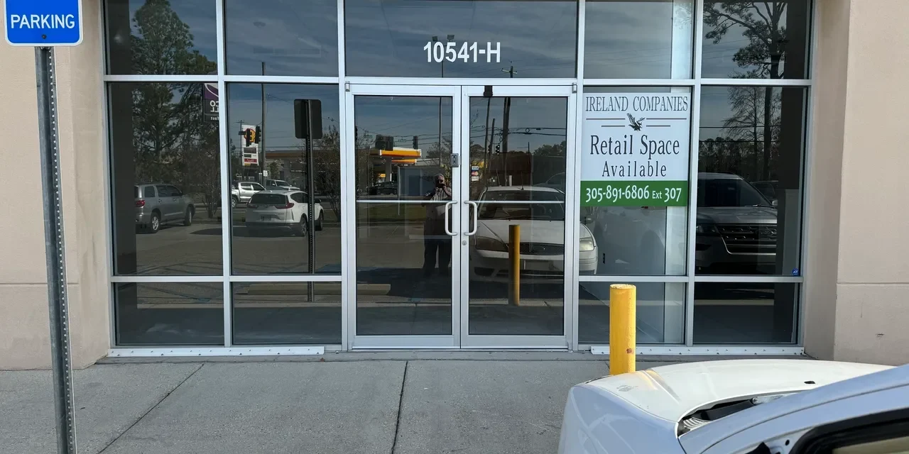 Retail space available sign on storefront window.